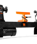 WEN benchtop wood lathe, black with orange tool rest, front view showing headstock and tailstock.