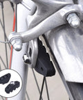 Close-up of a road bike caliper and brake pad. 2 Pairs Road Bike Brake Pads With Installation Tool Caliper Blocks 50 Mm Length.