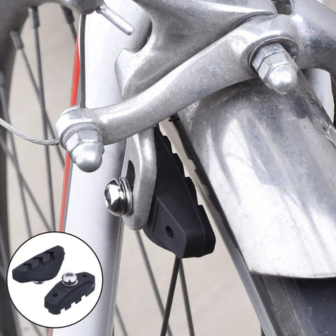 Close-up of a road bike caliper and brake pad. 2 Pairs Road Bike Brake Pads With Installation Tool Caliper Blocks 50 Mm Length.