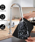 Hand washing Silicone Coffee Tamper Mat 8 Inch By 6 Inch For Espresso Tamping, Non Slip Barista Pad under a kitchen tap