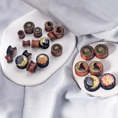 Six Piece Ear Plugs Set Sun Moon Natural Wood And Acrylic Tunnels Expander Plugs For Piercing Includes 0G 00G 8Mm 10Mm 12Mm And 14Mm Screw In Design displayed on trays