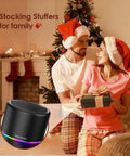 Couple exchanging gifts with Compact Bluetooth Speaker With 12 Hour Battery Life, Noise Reduction Microphone, RGB Lights in foreground.