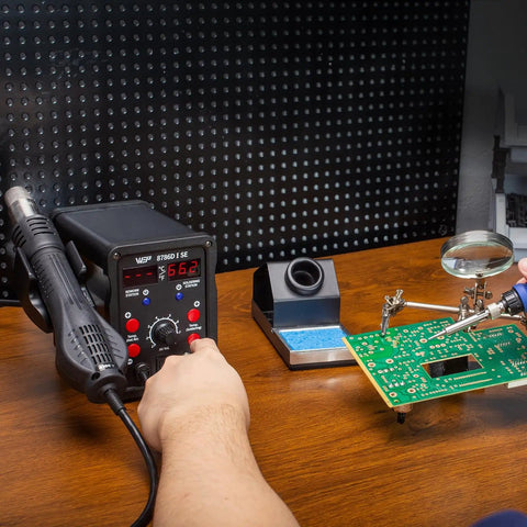 Person using 2 In 1 Hot Air Rework Soldering Station Kit With Desoldering Tool Lead Free Solder Wire Five Soldering Tips Three Hot Air Nozzles Tweezers And Desoldering Pump For Electronics DIYers on circuit board