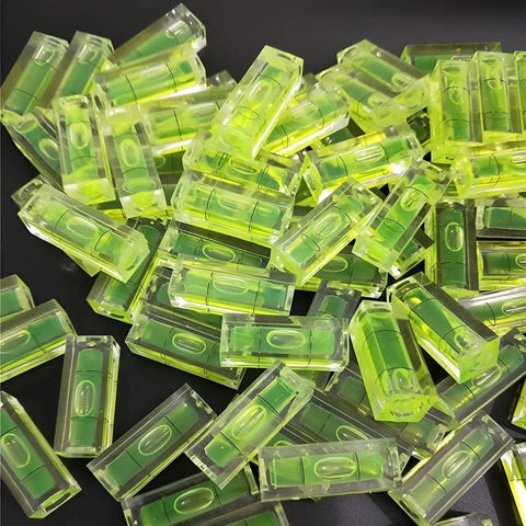 6Pcs Small Bubble Level 10x10x29mm Mini Square Spirit Level Picture, vibrant yellow liquid levels piled together.