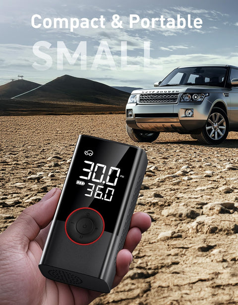 Hand holding Portable Tire Inflator Air Compressor 150 PSI Cordless Pump With LED Light And Digital Pressure Gauge near SUV