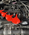 Five Piece Auto Oil Funnel Set With Flexible Neck And Filter Screen displayed on car engine