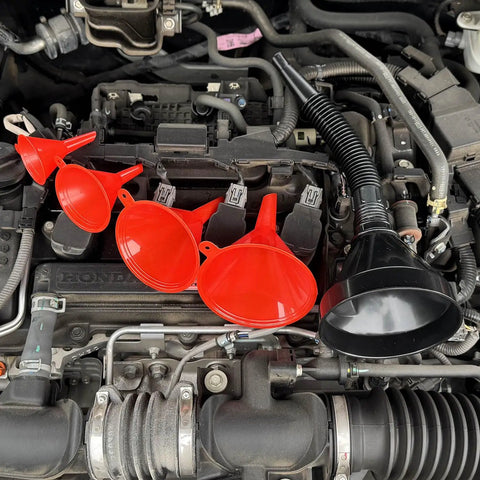 Five Piece Auto Oil Funnel Set With Flexible Neck And Filter Screen displayed on car engine