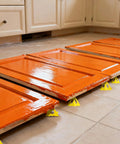 36 Pack Mini Painter Pyramid Stands For Painting And Pouring elevating orange cabinet doors on a tiled floor