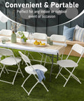Six Foot Heavy Duty Folding Table With Locking Legs And Carry Handle set up outdoors with chairs, decorations, and food for a party