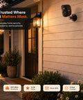 Smooth As Butter 2K Wireless Security Cameras 2 Pack mounted on house wall, enhancing entryway safety with night vision.