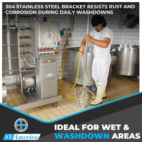 Worker using hose in washdown area with stainless equipment, illustrating Heavy Duty 4 Inch By 1.25 Inch Stainless Steel Caster Wheels use.