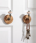 Old School Cool Antique Ceramic Wall Hooks With Rock Solid Wood Base Showstopper Entryway Coat Rack Pair on door.