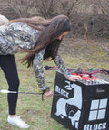 Woman with bow using Two-Sided High Velocity Archery Bag Target For Practice Up To 425 FPS Compact 28x28x12 Inch Size