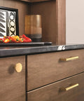 Slick Modern Cabinet Knobs With A Fresh Champagne Bronze Finish Dope Drawer Hardware For Kitchen Revamps on wooden cabinet.
