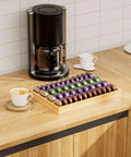 Bamboo Coffee Pod Drawer Organizer For Nespresso Vertuo Vertuoline Pods on kitchen counter with coffee maker
