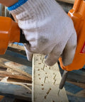 Pro Grade Air Punch Nailer Nail Remover Pneumatic Puller For Denailing And Wood Recycling in use on wooden pallet.