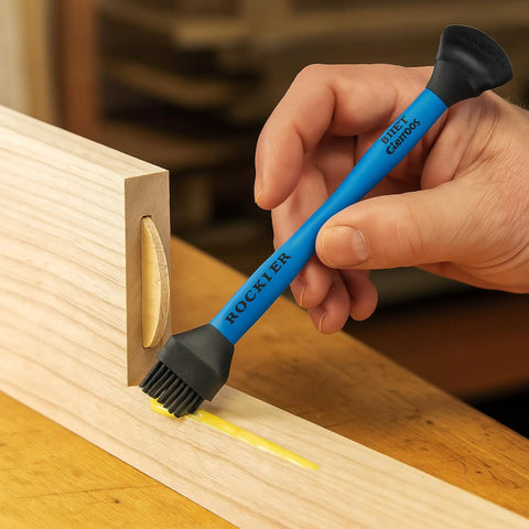 Easy Clean Silicone Glue Spreader in use on wood, showing dual end design with biscuit-tip and silicone brush for precise joinery