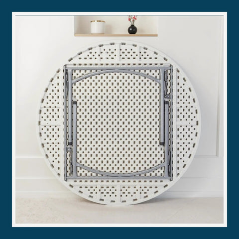 Round Folding Table Built Like A Tank For Heavy Duty Use, 60 inch diameter with speckled gray surface, folded view against wall.