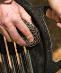 Person using Cast Iron Scrubber With Stainless Chainmail And Silicone Center, Food Safe And Rust Resistant, 304 Stainless Cleaner