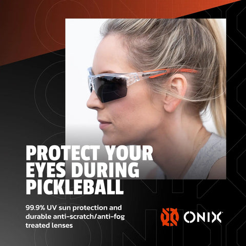 Protective Eyewear For Pickleball Players With Lightweight Game Ready Impact Resistant Frame Anti Fog And Anti Scratch Lenses 99 Percent UV Shield Includes Clear Smoke And Blue Tint Lenses Soft Non Slip Nose Pads For Secure Fit worn by player