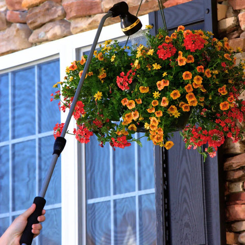 RelaxGrip No Sweat Eight Pattern Pivoting Head Watering Wand With Quick Connect Extension Extends From 33 To 48 Inches For Reaching High And Far Plants Black And Yellow used to water hanging flowers.