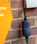 Weatherproof Outdoor Outlet Switch With Wireless Remote Controller installed on brick wall, power ratings displayed