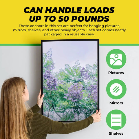 Person hanging picture frame illustrating use of Heavy Duty Self Drilling Drywall Anchors And Screws Kit With Reusable Storage Case Includes 50 Drywall Anchors And 50 Number 8 One And One Quarter Inch Screws For Quick No Pre Drill Install In Drywall Perfect For DIY Projects By Qualihome