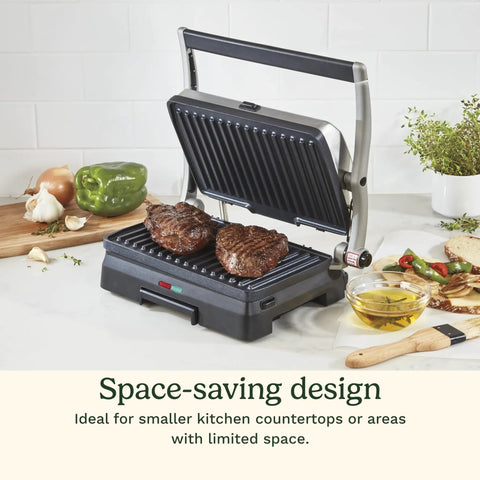 Cuisinart Griddler Indoor Grill And Panini Press With Removable Nonstick Plates cooking steaks on a countertop, ideal for small spaces.