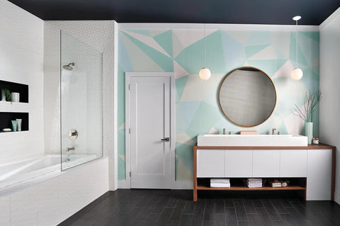 Modern bathroom with geometric wall, oval mirror, and Xander Widespread Bathroom Faucet Brushed Nickel Three Hole Configuration.