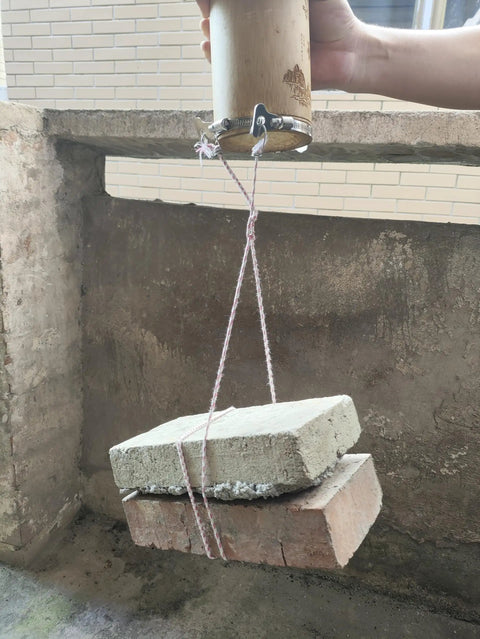 Testing the strength of a 16-Piece 304 Stainless Steel Hose Clamps Set With Adjustable Thumbscrews And T-Bolt Worm Clamp And Band Clamp Mix For 6-12mm To 38mm Hoses, lifting bricks, viewed in use.