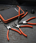 Heavy Duty Snap Ring Pliers Set Four Piece Kit For Internal And External C Clip Rings With Straight And Bent Jaws on table