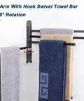 Top Shelf Swivel Towel Rack Built From Solid 304 Steel Spacious Four Arm Wall Mount Bath Station Sporting Rustproof Spin Nifty Side Hook And Chill Matte Black Finish with towels hanging.