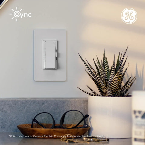 Effortless Install Paddle Dimmer Smart Switch With Matter Ready Wiring And Alexa Support For Smooth Lighting Control mounted on a wall next to a plant.