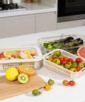 Square Glass Food Storage Containers With Glass Lids For Grab And Go Meals Microwave Safe Borosilicate Glass Leakproof Meal Prep Set BPA Free Removable Colander Silicone Lid 2 Pack with fruits and vegetables displayed on a kitchen counter