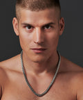 Man wearing mechanic style stainless steel mens necklace link chain silver tone dope polished finish mens jewelry 19 to 23 inch length