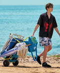 Person using Two In One Beach Cart With Big Wheels For Sand Folding Utility Wagon With Chair Holder Cooler Bag Mesh Storage on beach