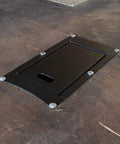 Recessed Motorcycle Wheel Chock for Trailers, Heavy Duty Powder Coated Steel Construction, Keeps Your Ride Locked In During Transit, Fits Most Tires Up to 6.25 Inches Wide, Simple Install on 16 Inch Cross Member Spacing; image shows the front view of recessed installation on trailer floor.