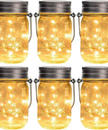 Hanging Mason Jar Solar Lights 6 Pack With 30 LED Lanterns, Waterproof Outdoor Decor in warm amber glow
