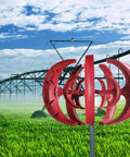 600W Vertical Axis Wind Turbine Kit With 5 High Efficiency Blades, red finish, in field near irrigation system, aluminum frame