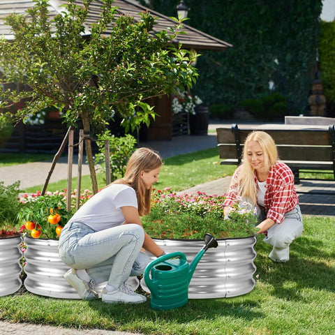 Two women gardening in a Raised Garden Bed Kit 2x2x1ft Galvanized Outdoor Planter Boxes With Easy Assembly For Vegetables, Fruits, And Flowers