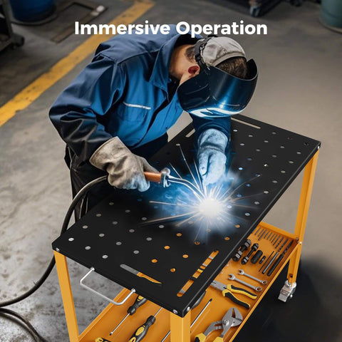 Worker using heavy duty 1200 lb welding table with 36 by 18 inch cold rolled steel top in a black oxide finish in garage setting