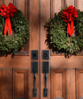 Matte Black Front Door Handle Set For Double Doors With Dummy And Lever Built To Last Tough As Nails Lock Set visible on wooden doors with wreaths