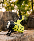Beast Mode Rechargeable LED Spotlight For Outdoor, Marine, And Emergency Use 1400 Lumens, 400,000 Candela Peak, on tree stump