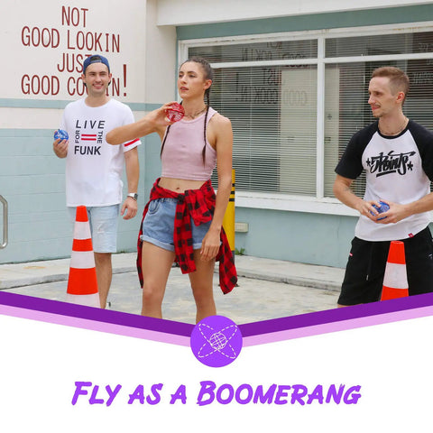Three people playing with Hand Operated Flying Orb Drone With Magic Controller 360 Degree Spin And RGB Lights in a street setting.