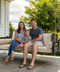 Family sitting on Three Seat Hanging Porch Swing With Cup Holders And Three Back Cushions, Extra Wide 60 Inch Swing Chair for the backyard