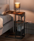 C Shaped End Table With Charging Station For Sofa And Living Room, with lamp on top, showing storage bag and outlets