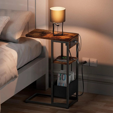 C Shaped End Table With Charging Station For Sofa And Living Room, with lamp on top, showing storage bag and outlets