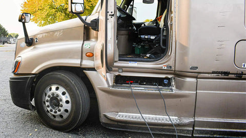 Heavy Duty Battery Booster Cables 16 Feet With 500 Amp Clamps in use on a truck roadside jump-starting, copper welding cable visible