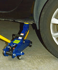 2 Ton Hydraulic Floor Jack With 4000 Lb Lift Capacity lifting vehicle, blue steel construction, in use in a garage setting.