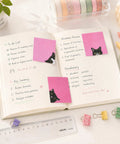 Black Cat Sticky Notes 3 By 3 Inch Set Stick Like Crazy For Back To School And Office Use on notebook with tasks.